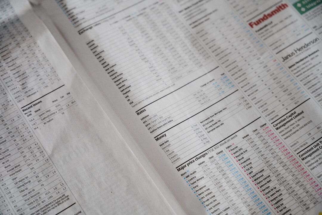 Printed market charts and reports on a table